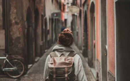 most beautiful small towns woman walking in a narrow stree