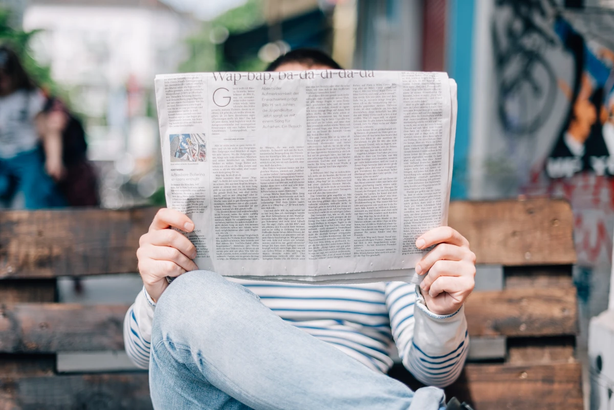 person reading the newspaper