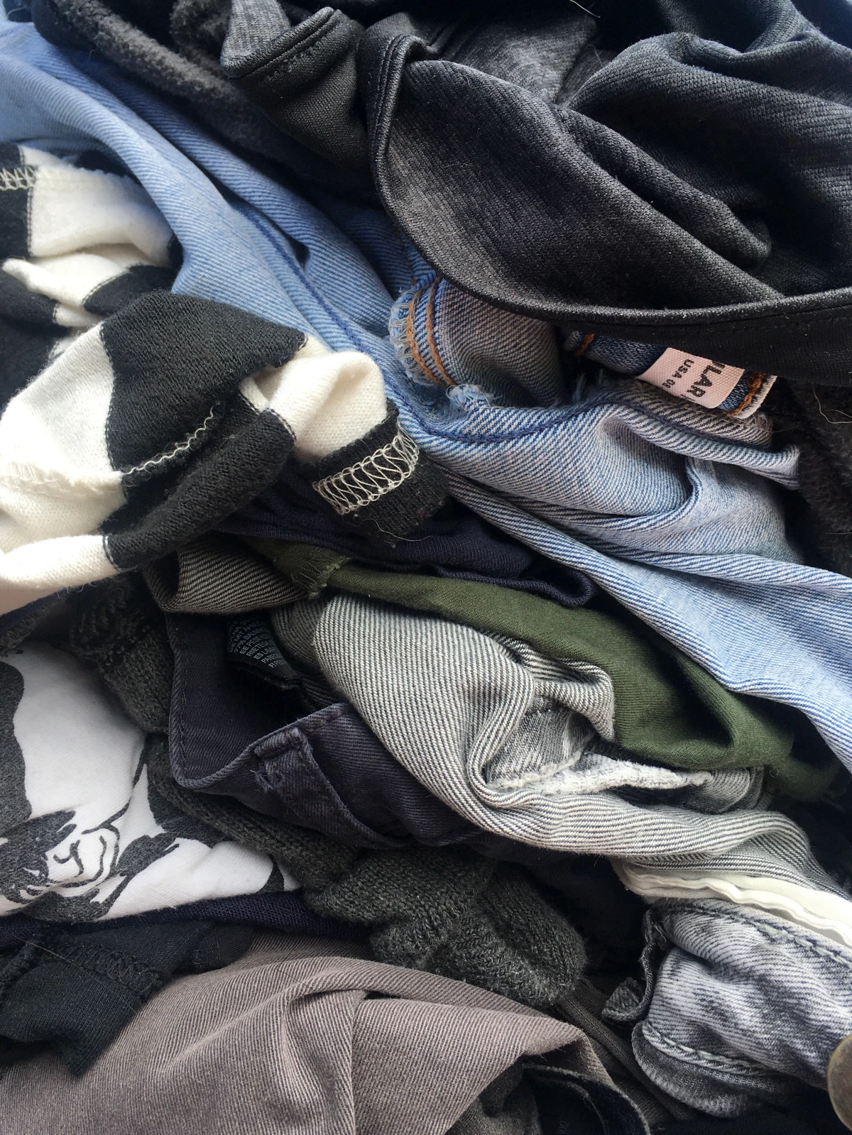 things you should never store in your garage pile of clothes