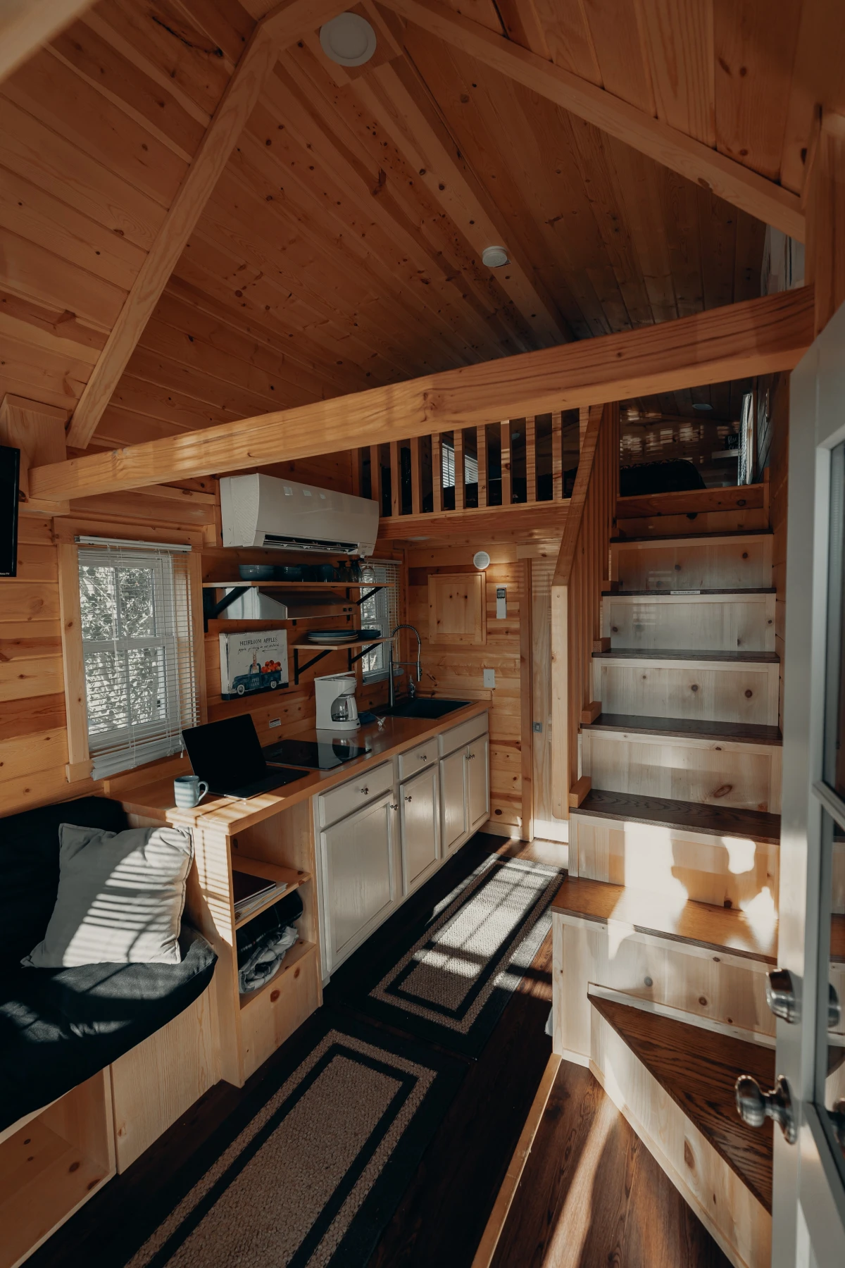 tiny wooden cabin inside of kitchen