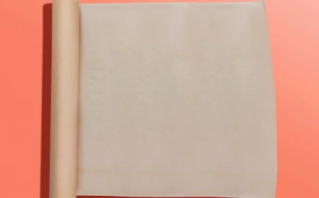 unrolled wax paper on pink background
