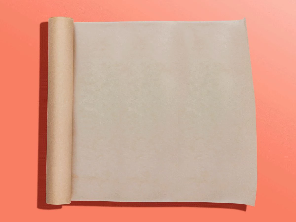 unrolled wax paper on pink background
