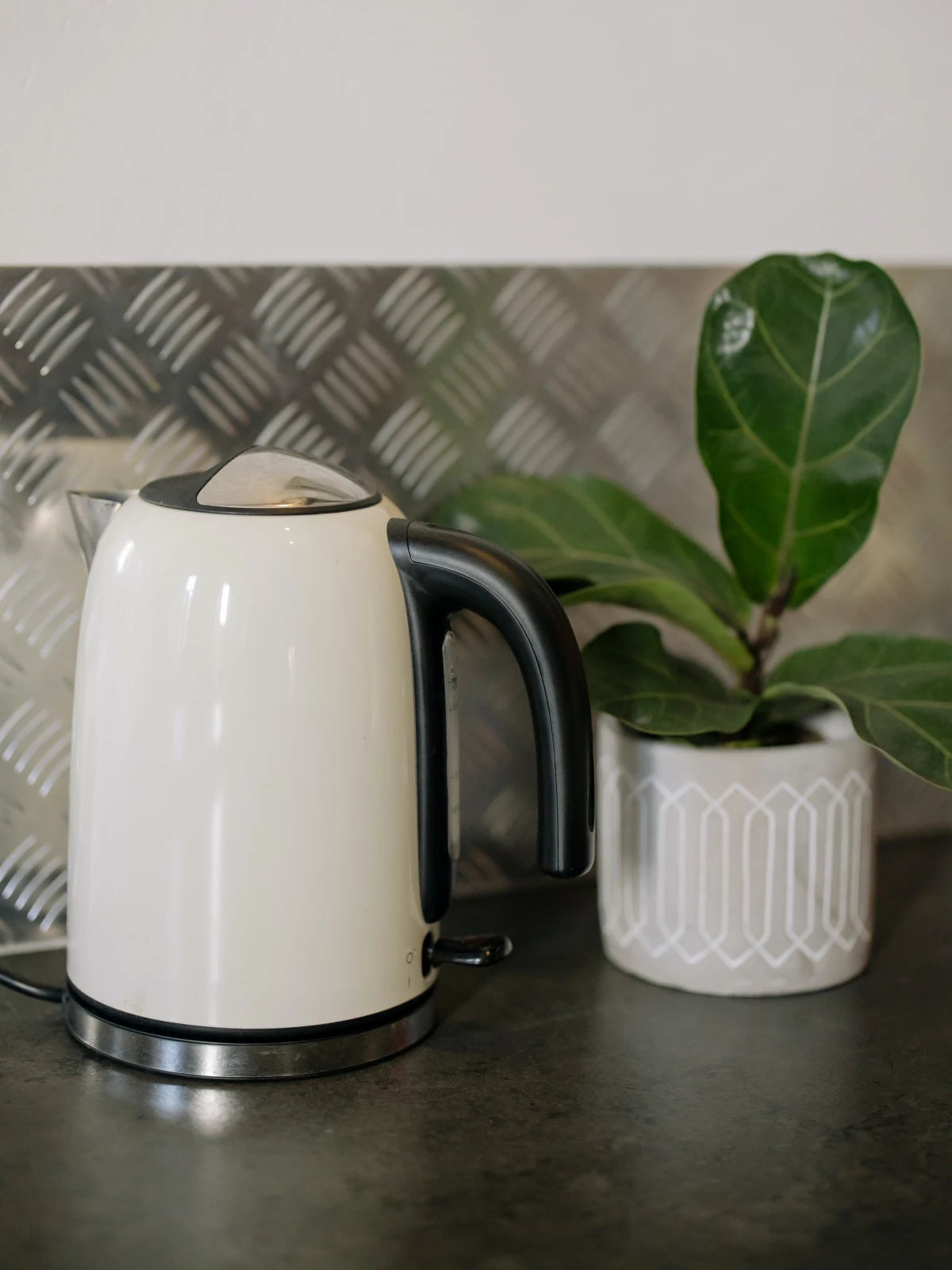 white electric kettle on counter