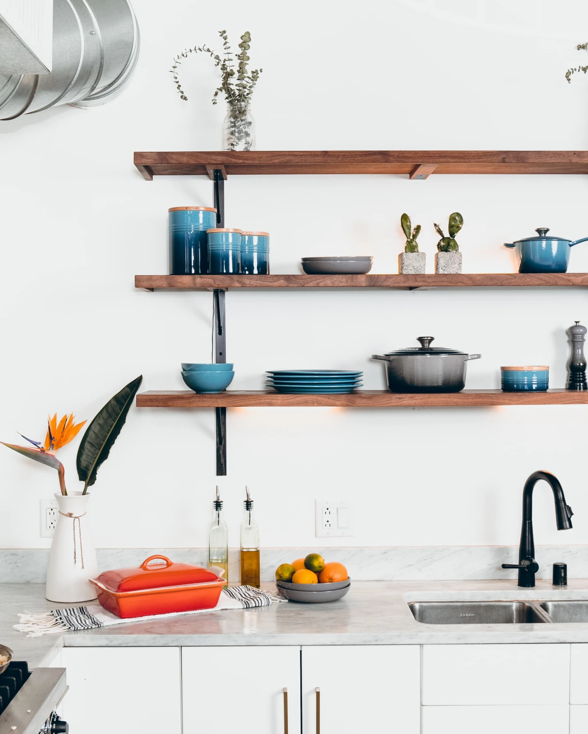 wooden shelves in kitchen with pots