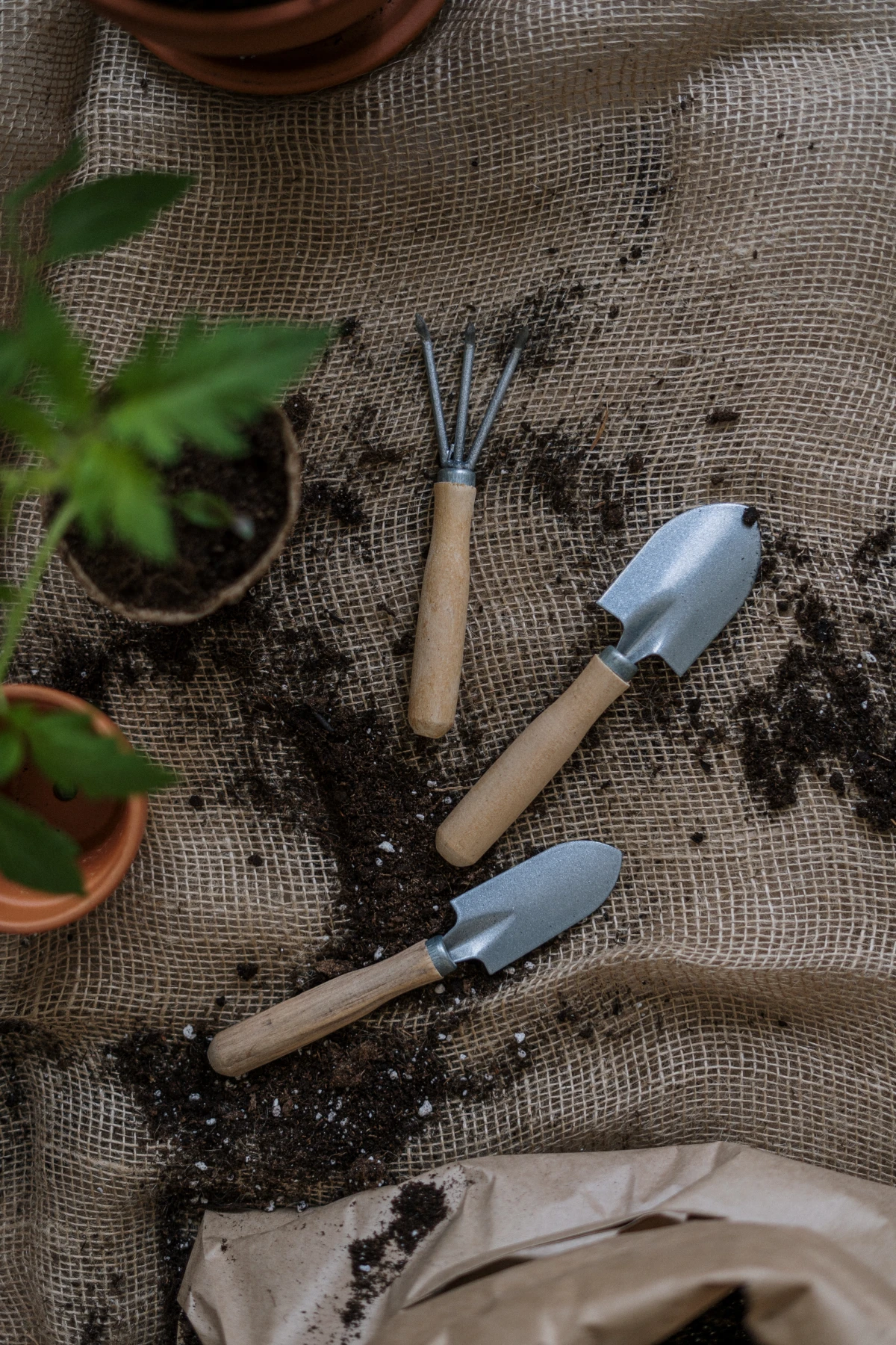 garden tools on brown tarp