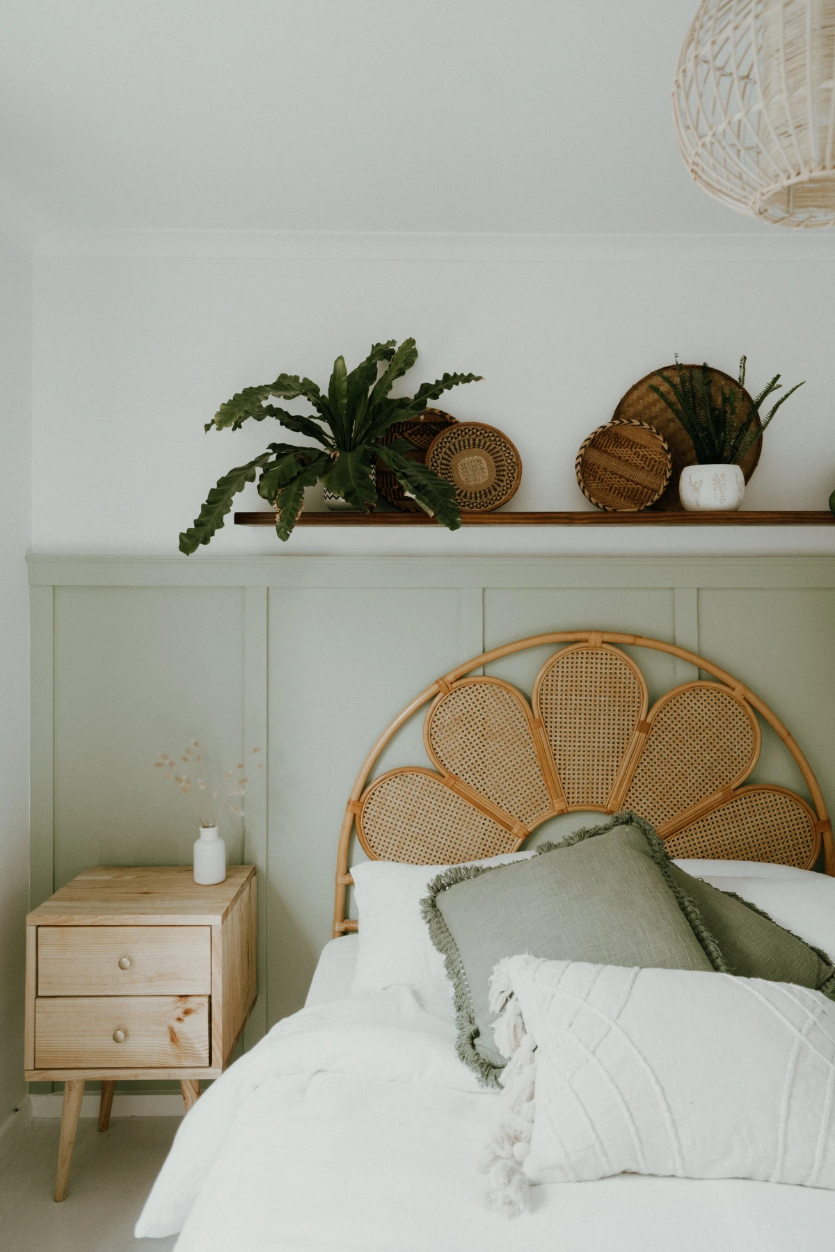 green bedroom with headboard woven