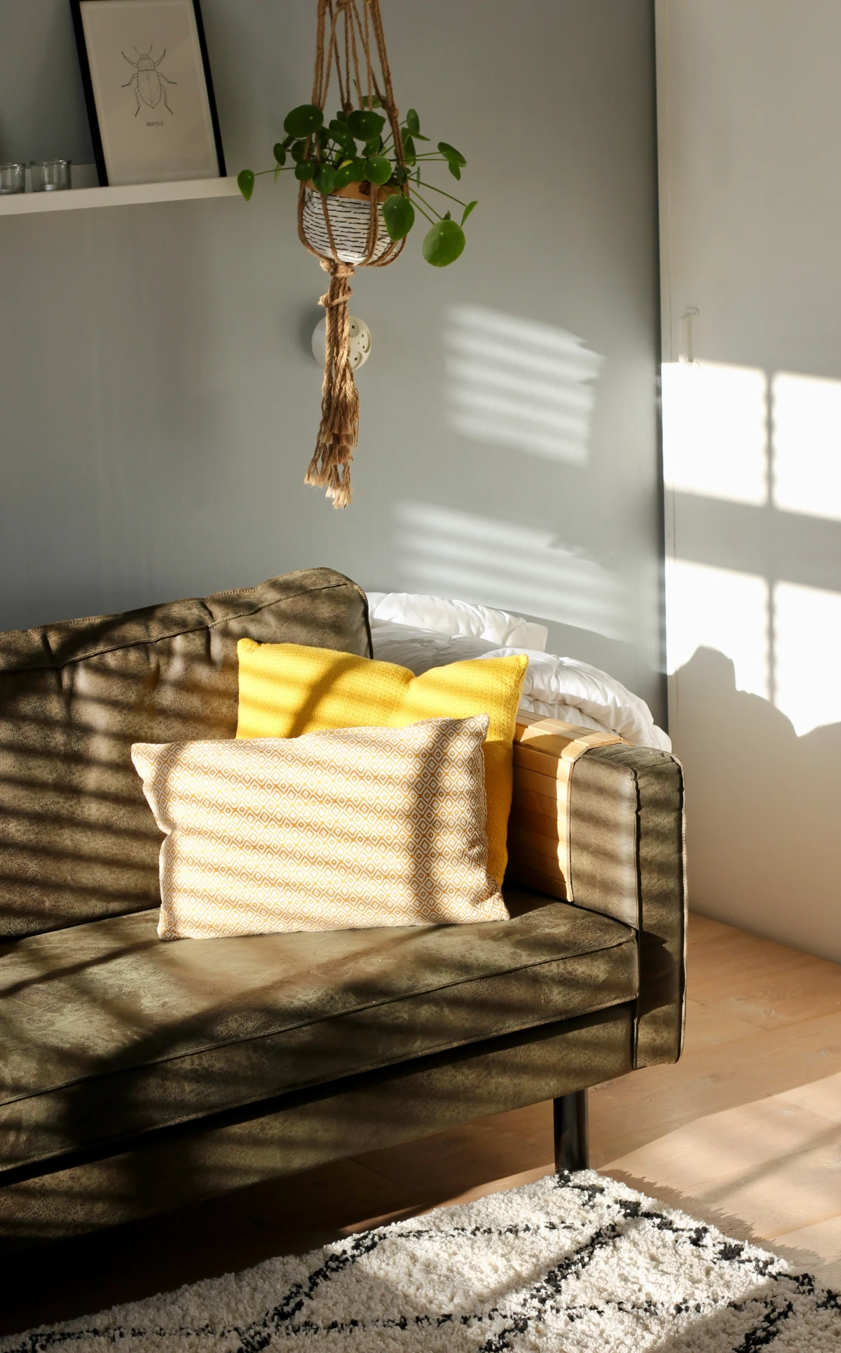 interior design secrets sofa with yellow pillows