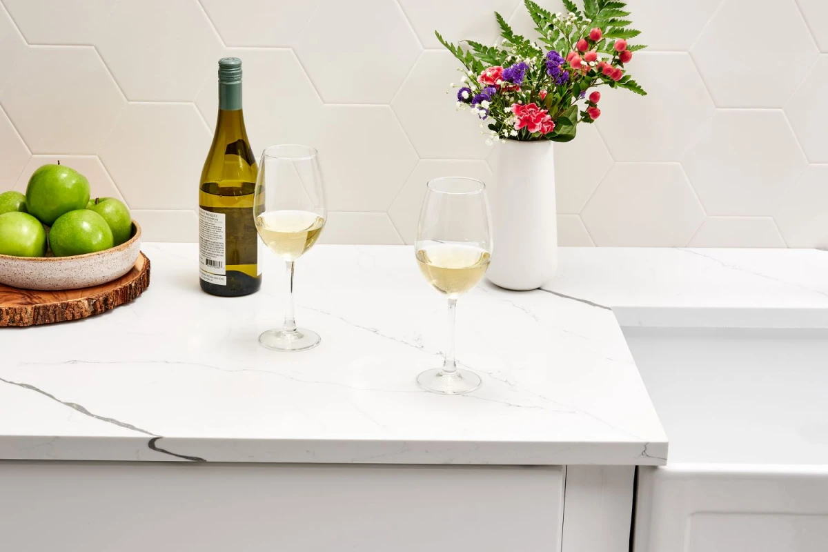 quartz countertop in white with two glasses of wine