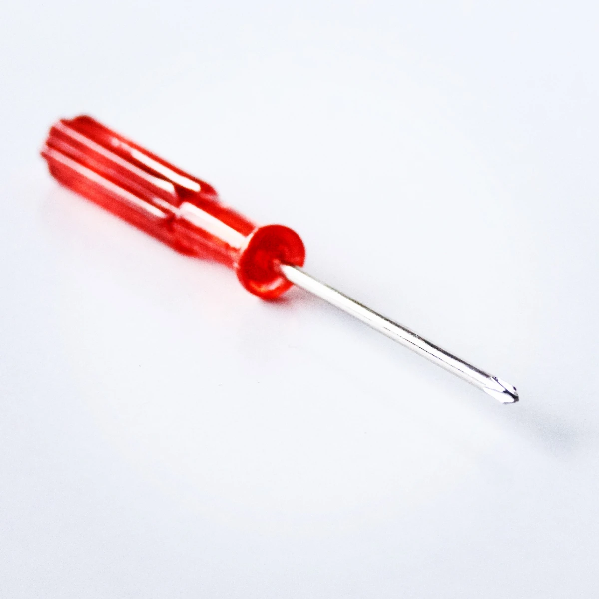 red screwdriver on a white background