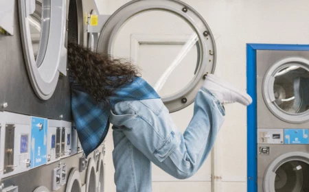 woman half inside a dryer
