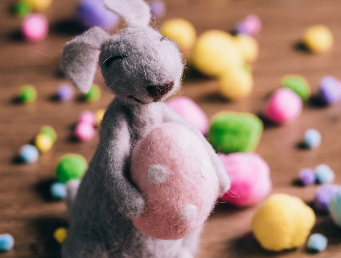 a fluffy rabbit with easter eggs