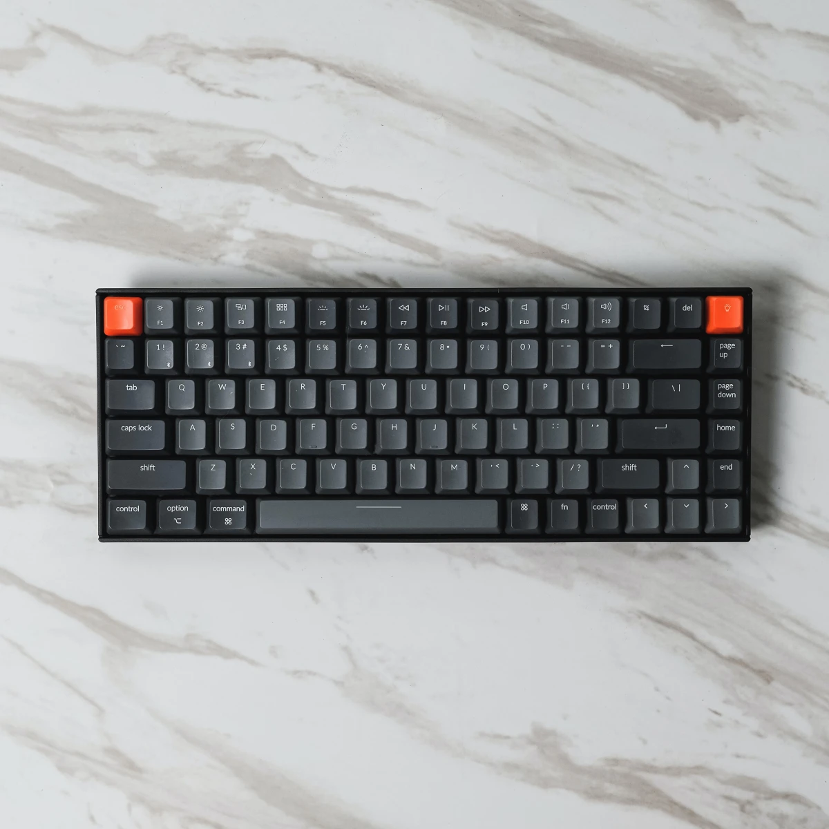 black keyboard on marble counter