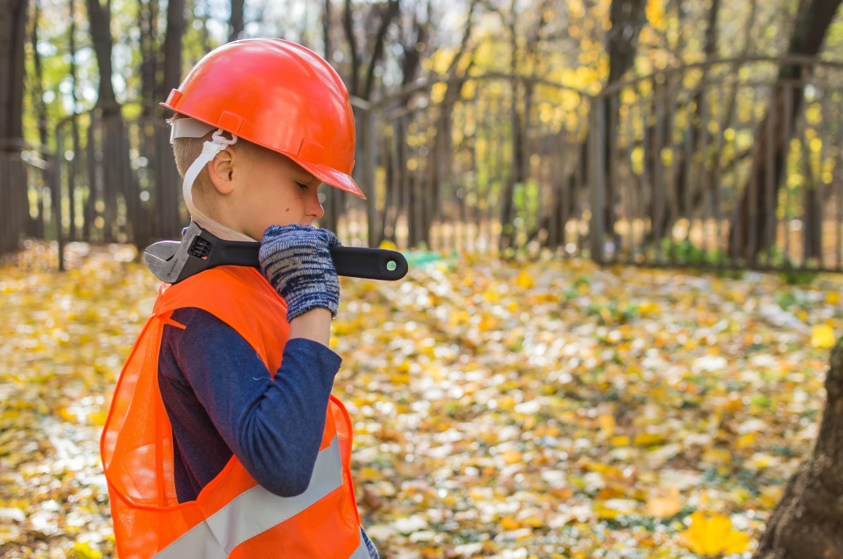 kid dressed in safety worker clothes