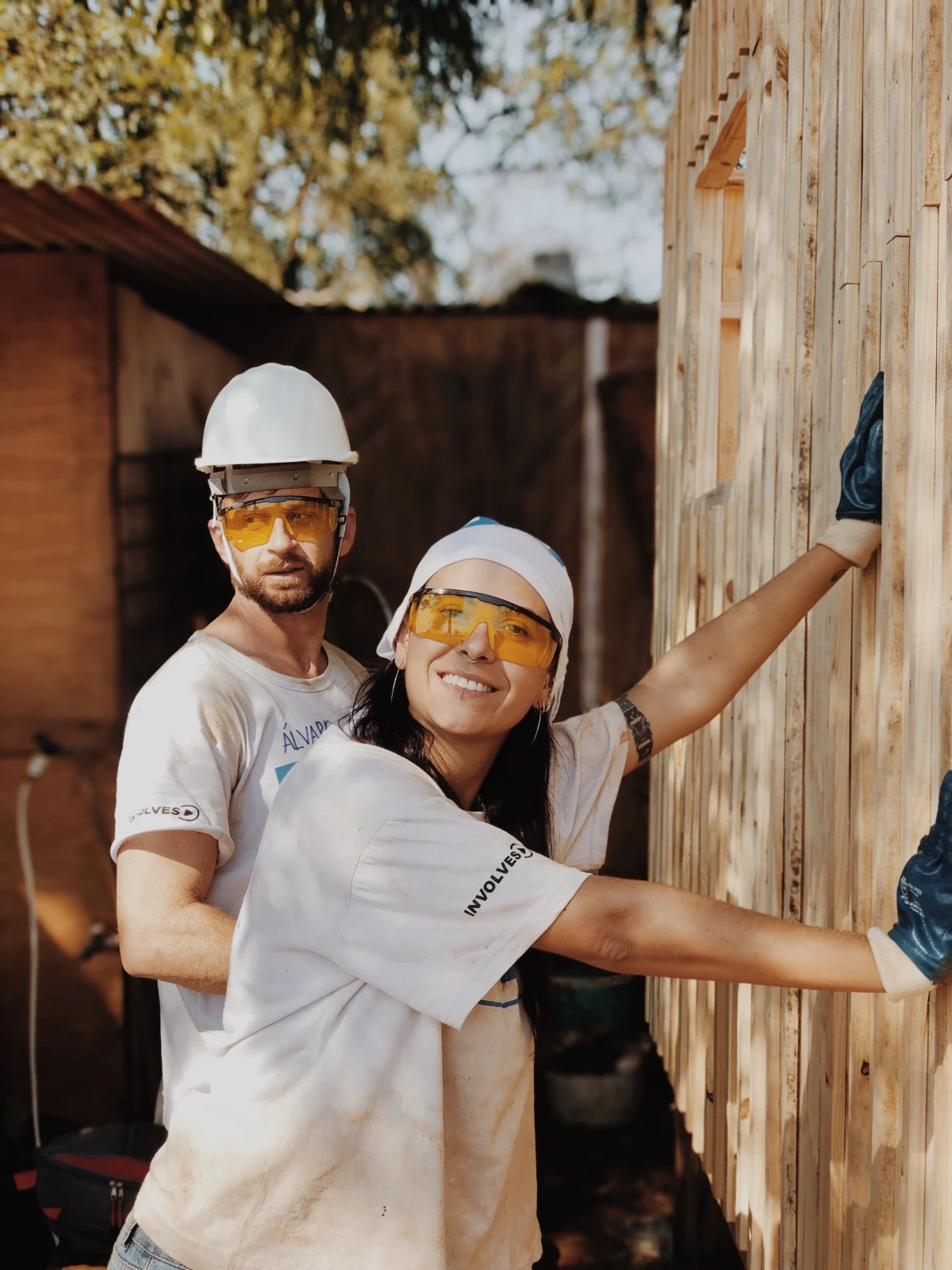 man and woman renovating outside