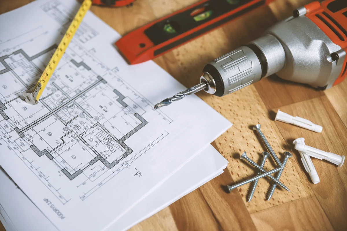 power drill and architecture plans