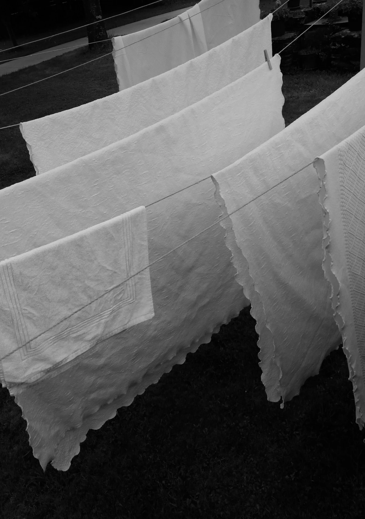 white linens on a drying rack