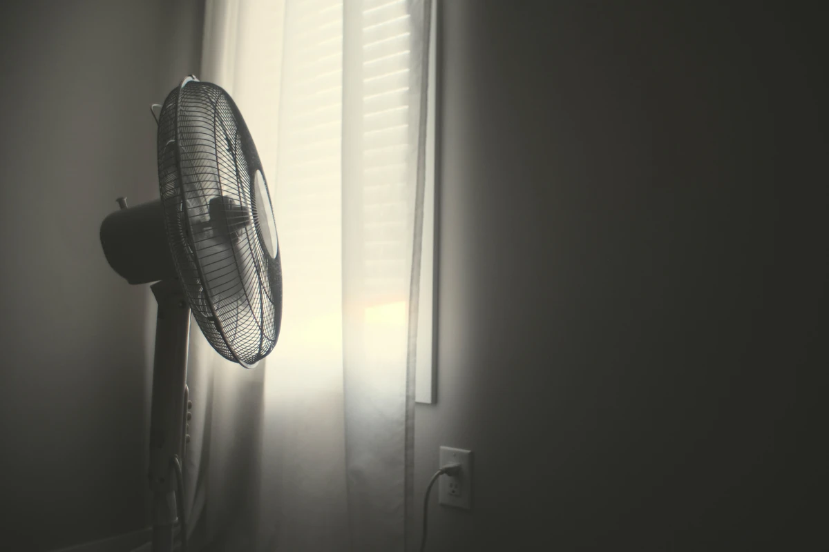 fan proped to dry walls