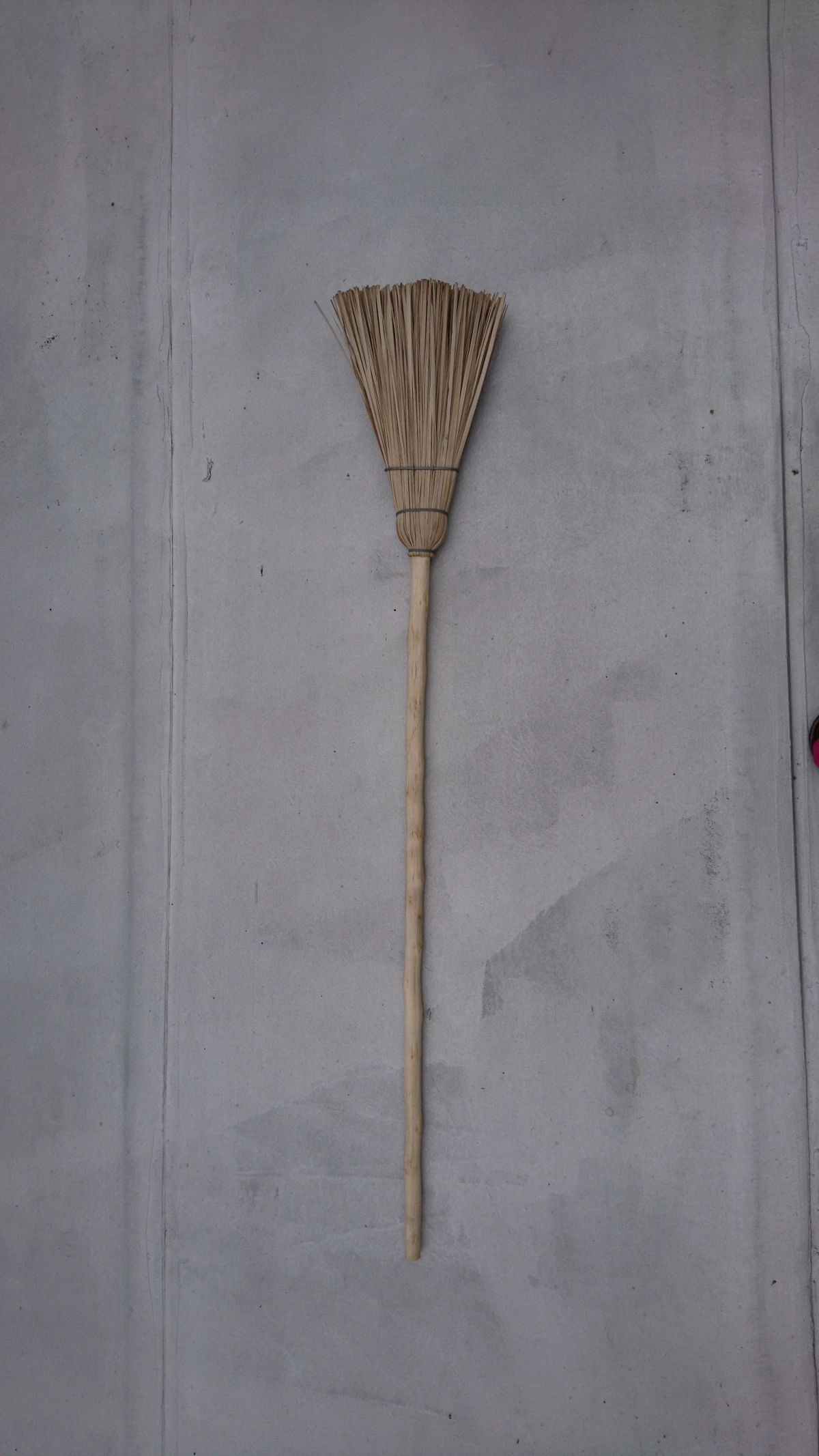 long broom on gray background