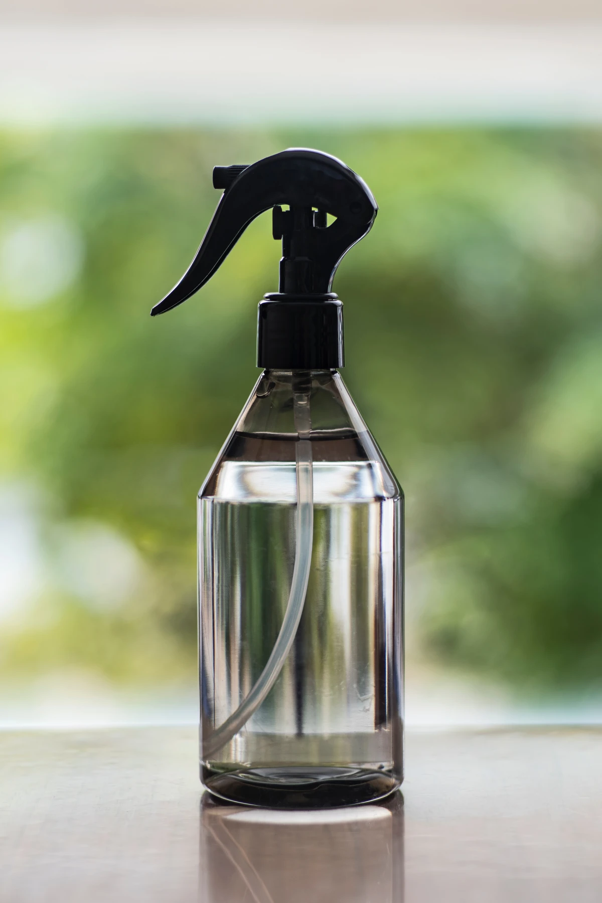 spray bottle with clear liquid