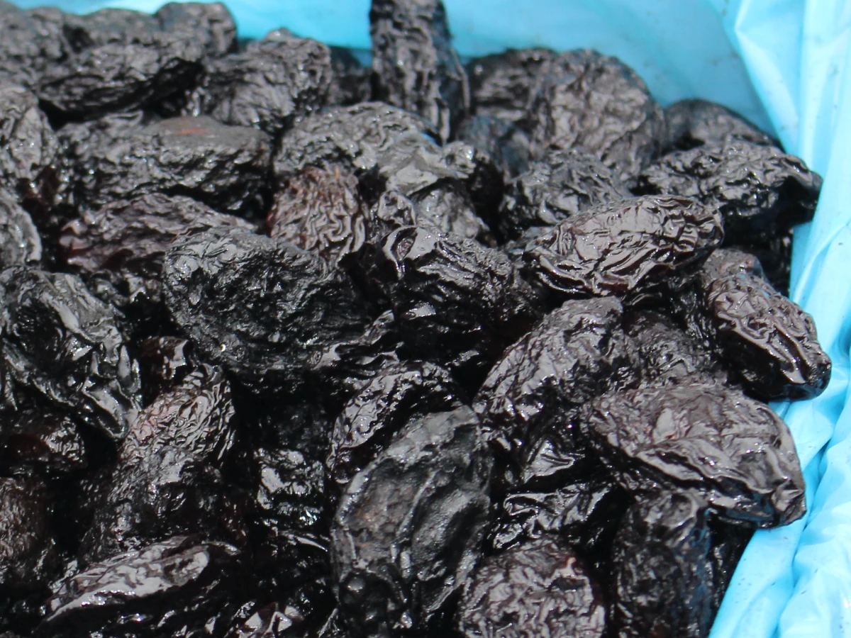 home remedies black prunes in a blue bag