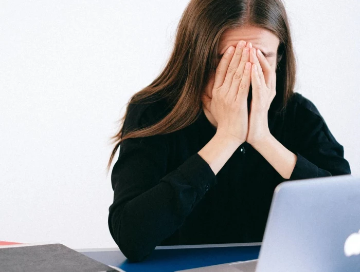 person stressed on computer