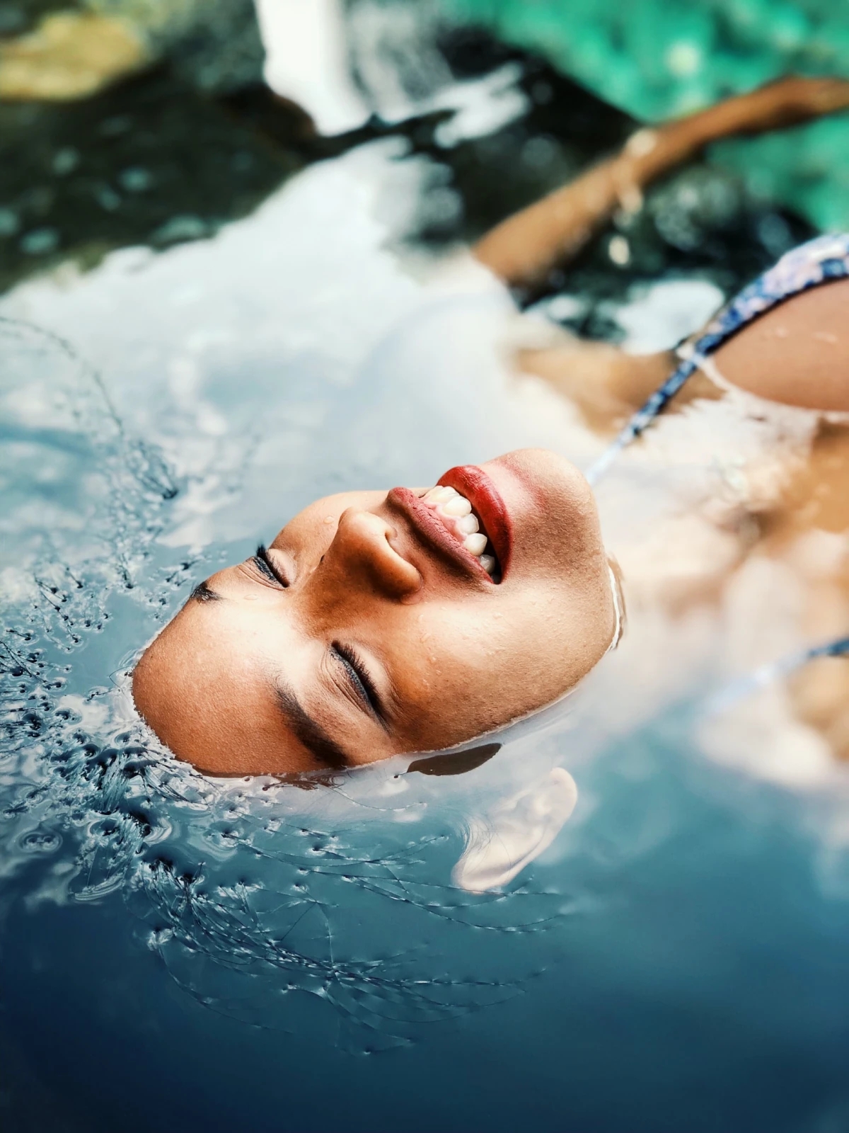summer skincare woman in the water face floating