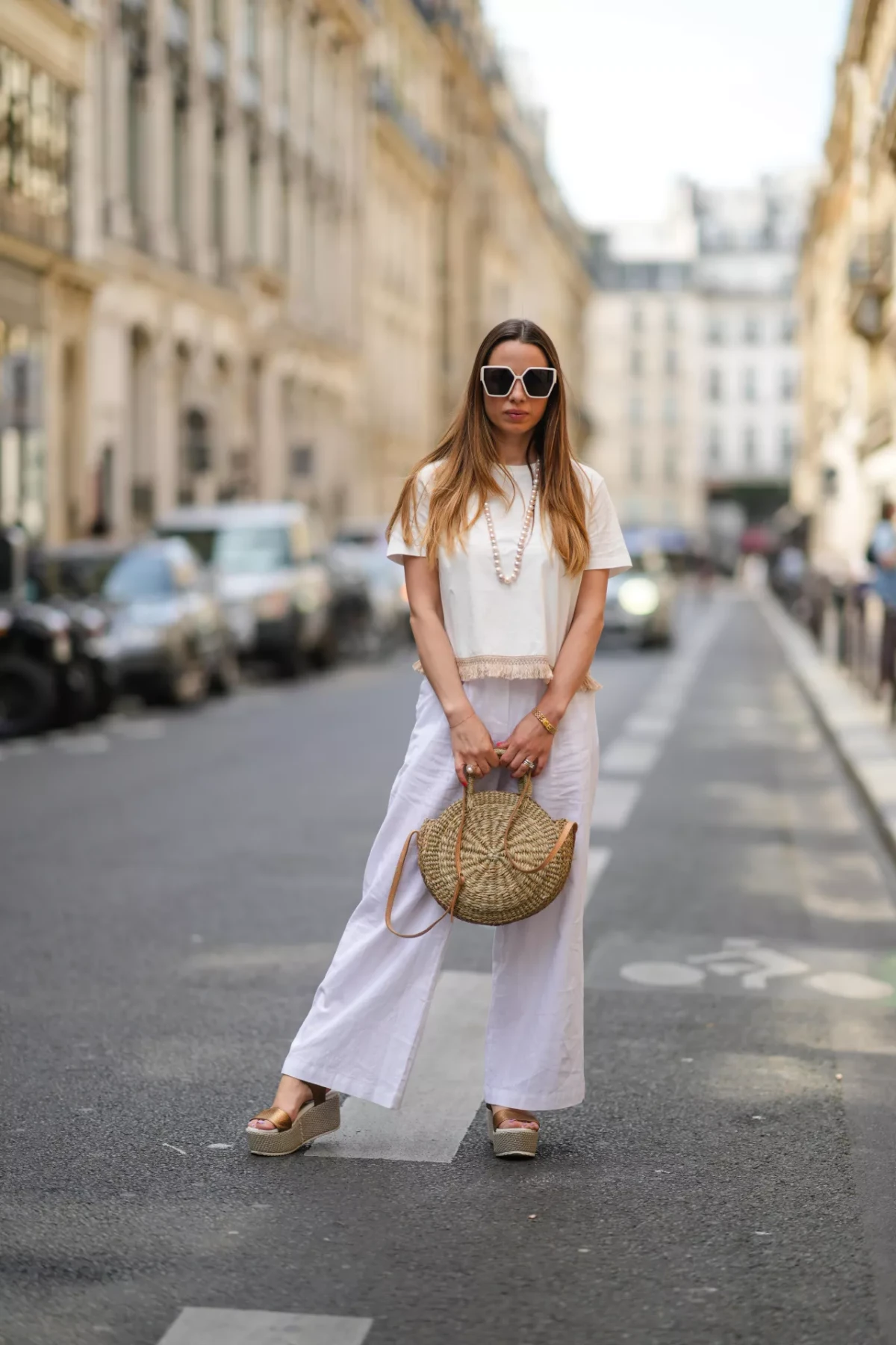 woman with sandals t shirt and linen pants
