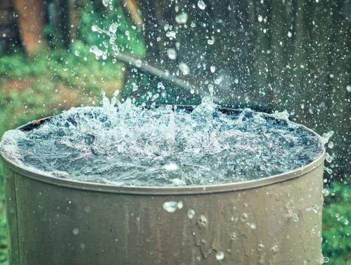 rain falling into a barrel