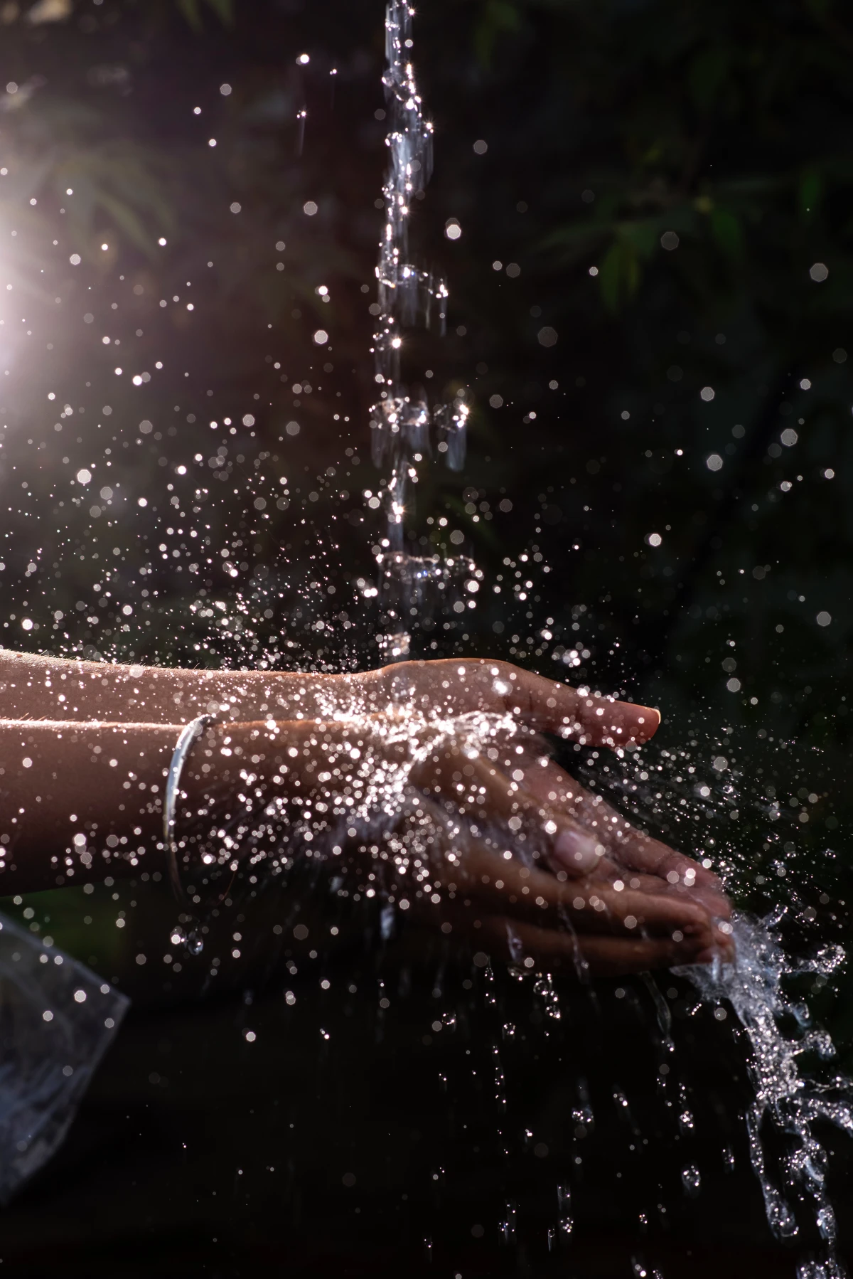 water running in persons hands