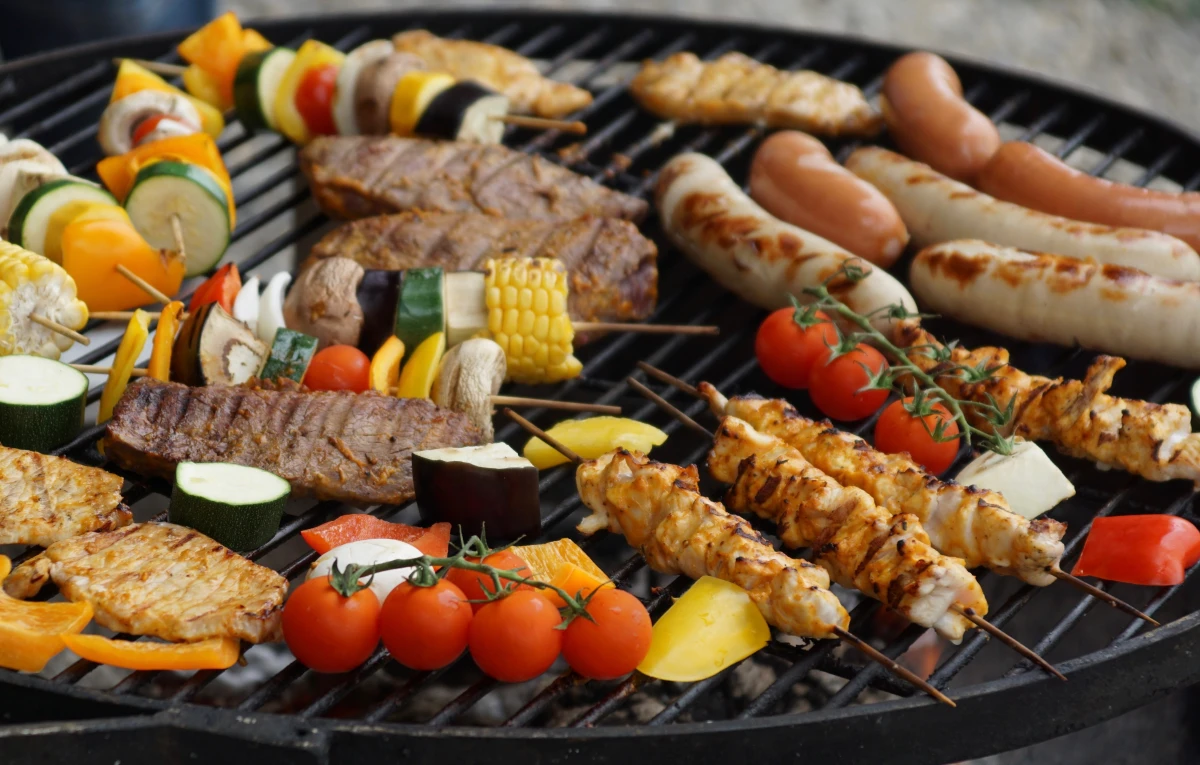 overcrowded grill with food