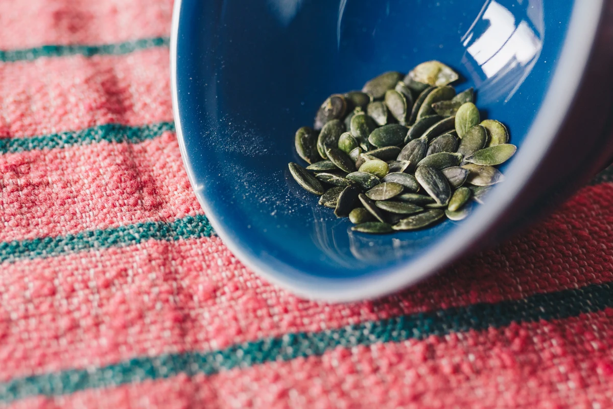 health benefits of pumpkin seeds pumpkin seeds in a bowl