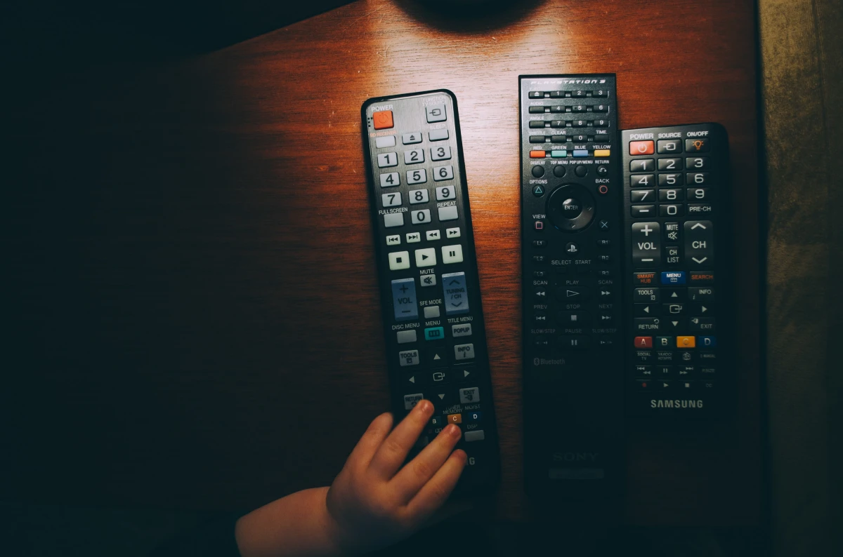 three remotes on table