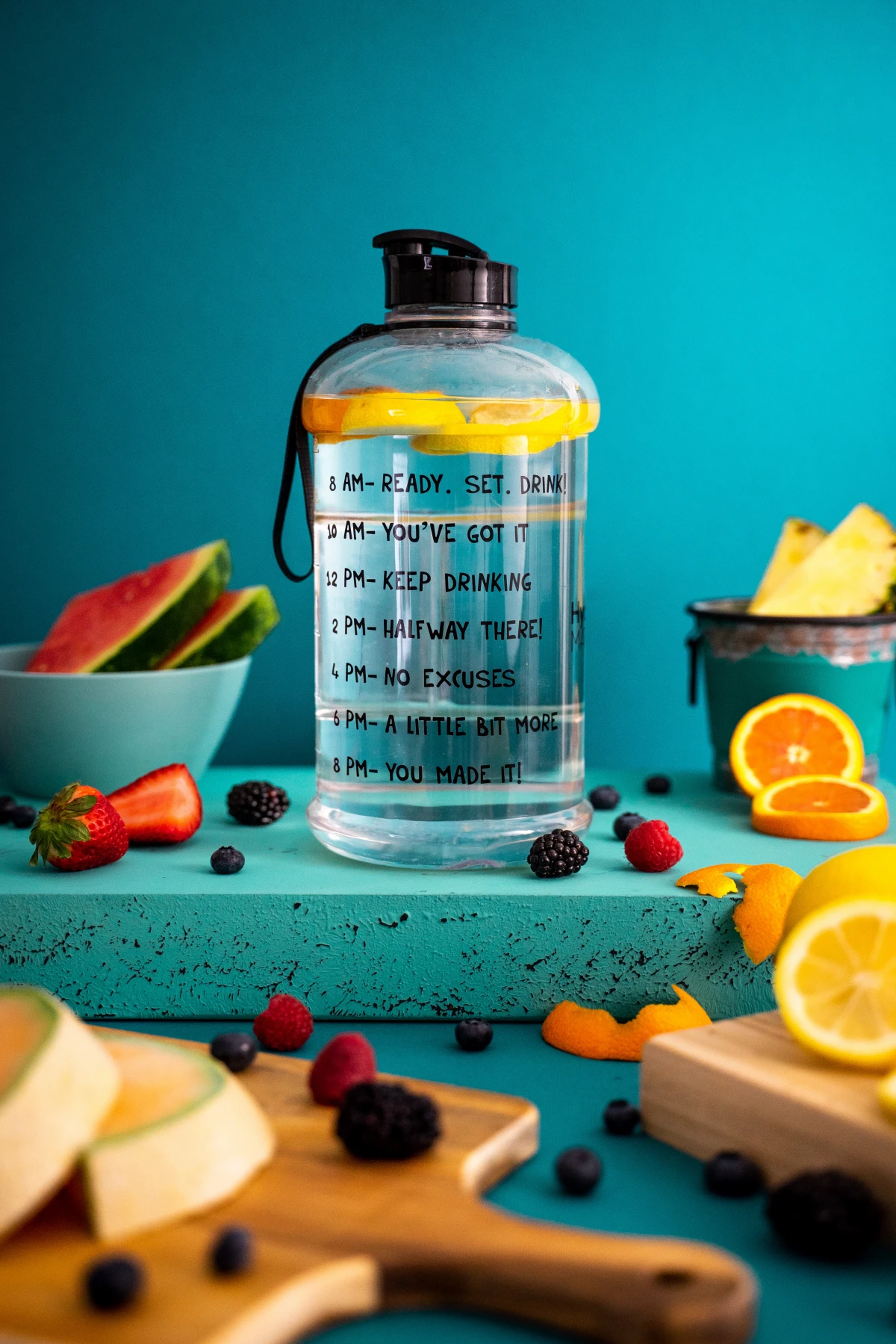 water bottle with lemon and oranges