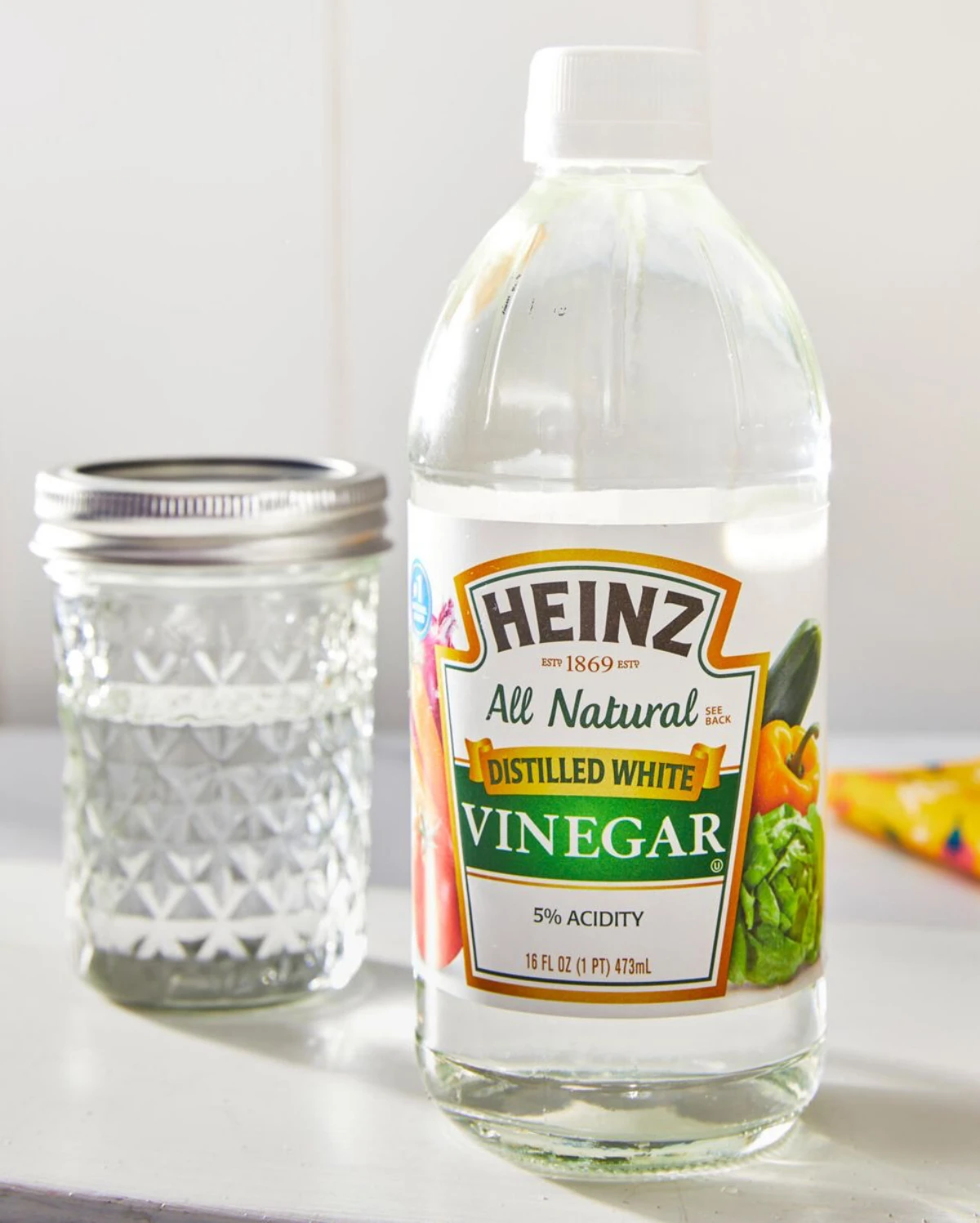 white vinegar bottle with glass
