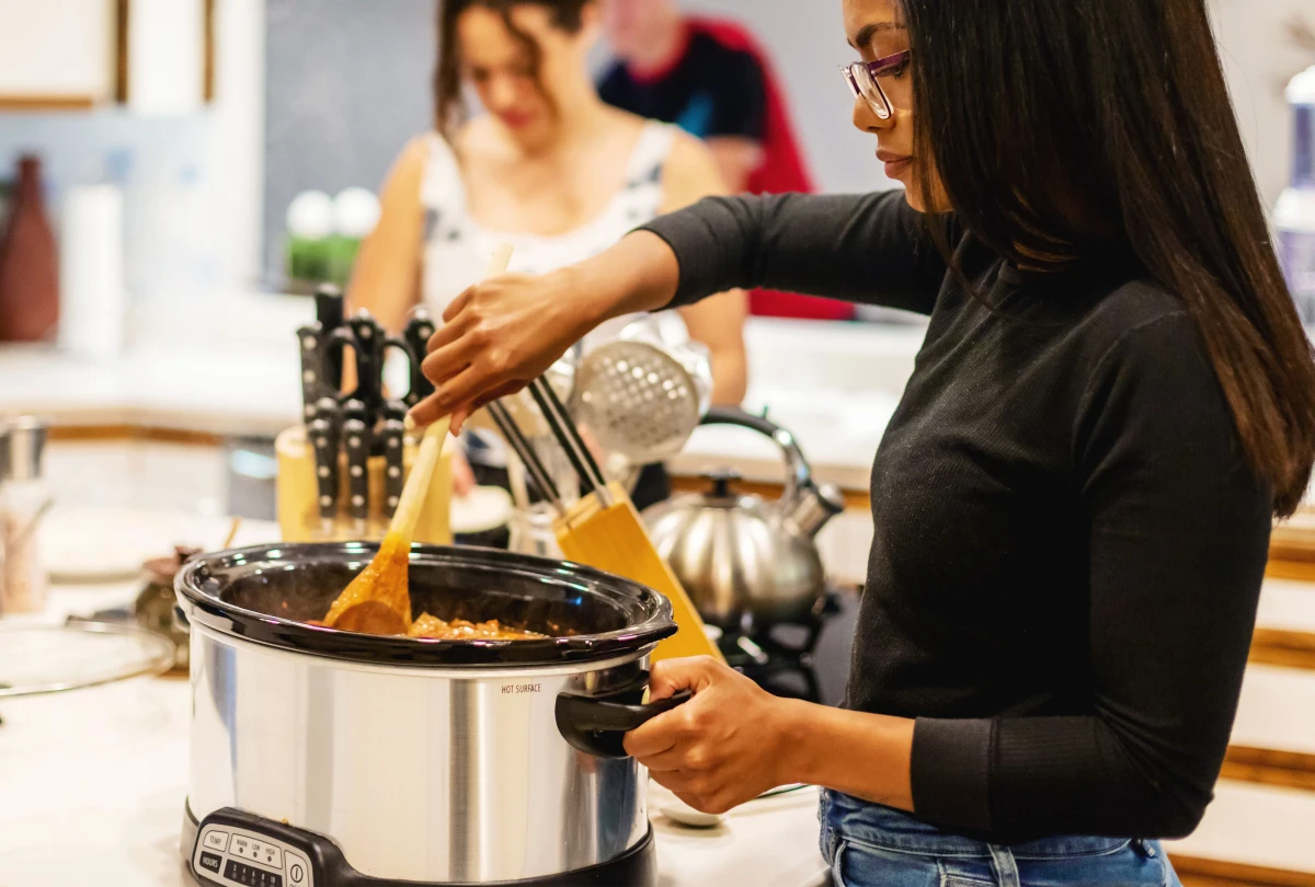 woman using a slow cooker