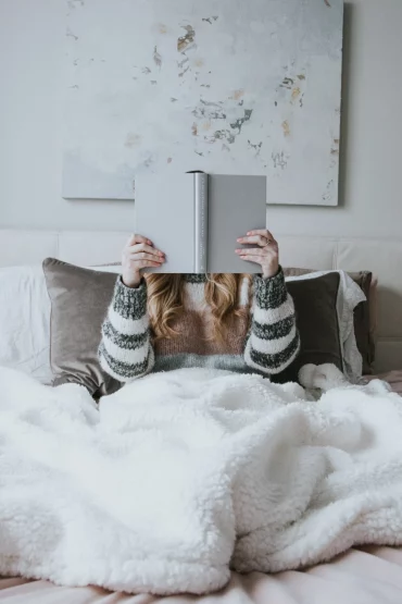 boo basket reading in bed