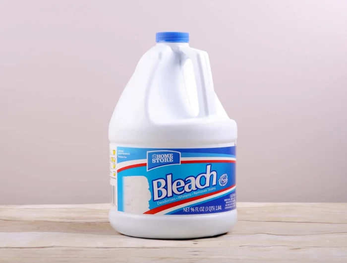 never clean with bleach bleach bottle on pink background