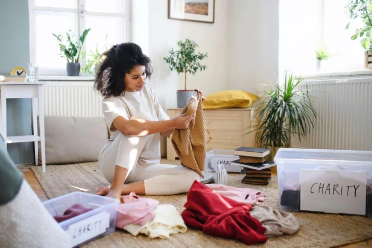 signs you should stop decluttering woman on the floor decluttering