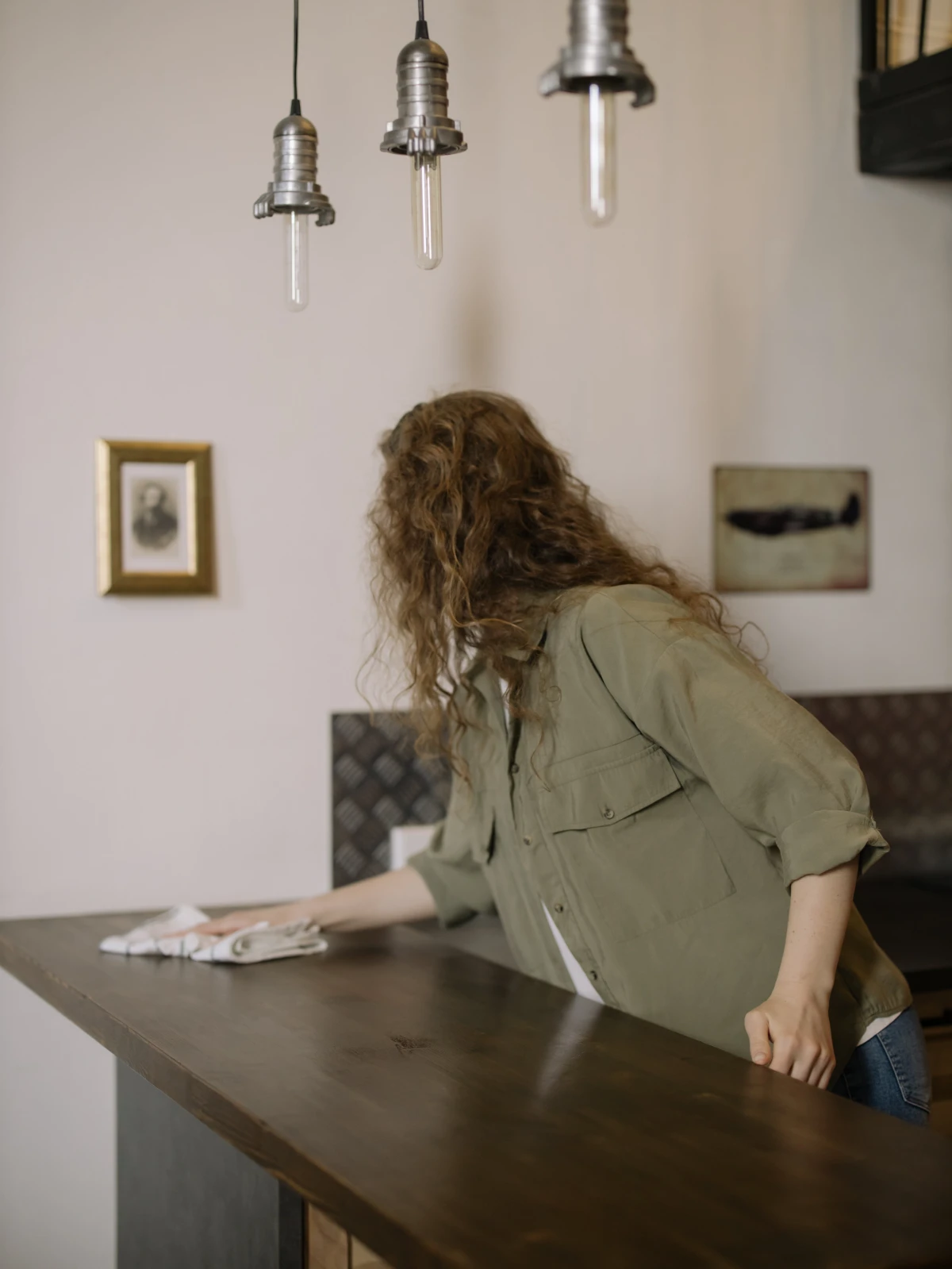 woman wiping down the counter