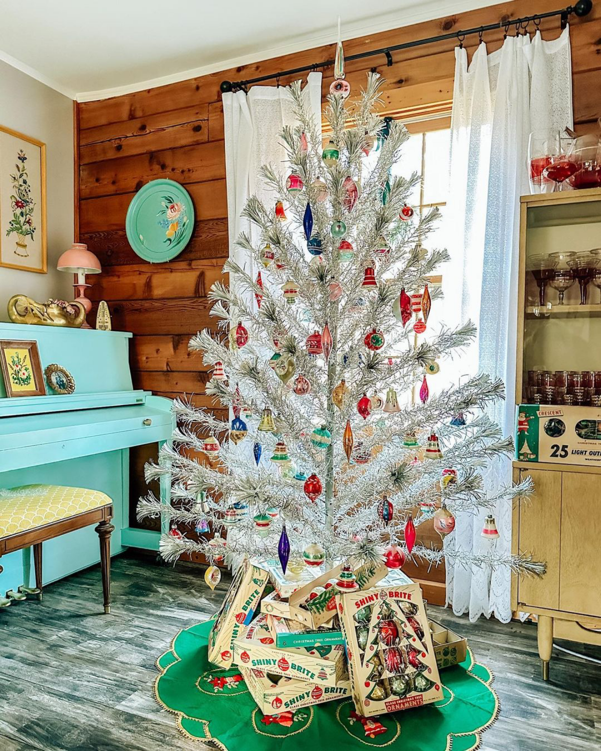 aluminum christmas tree decorated with ornaments