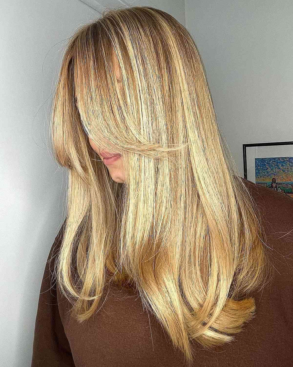 buttery golden blonde on a long straight cut