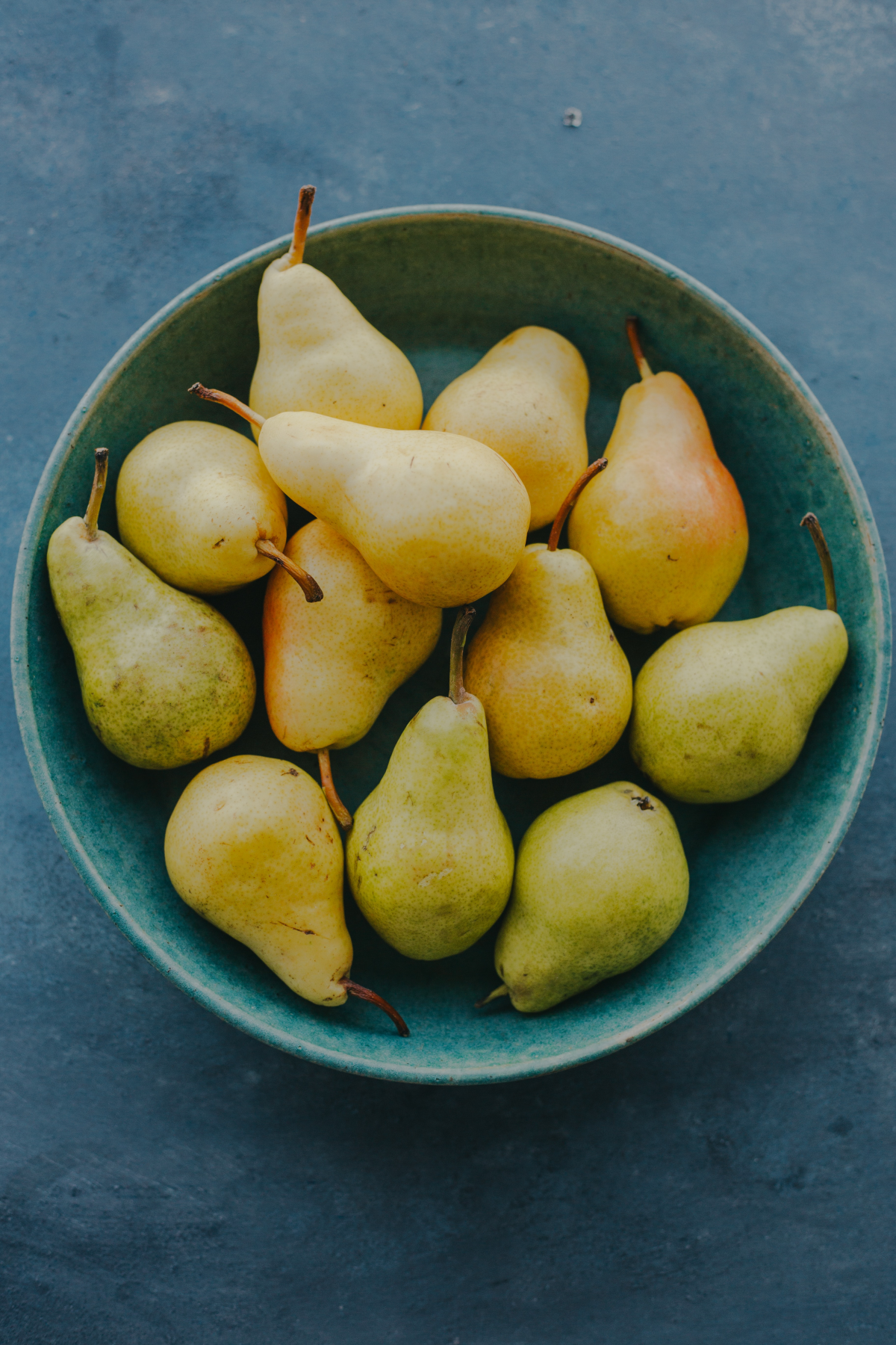 fruits that are in season in winter pears in a bowl