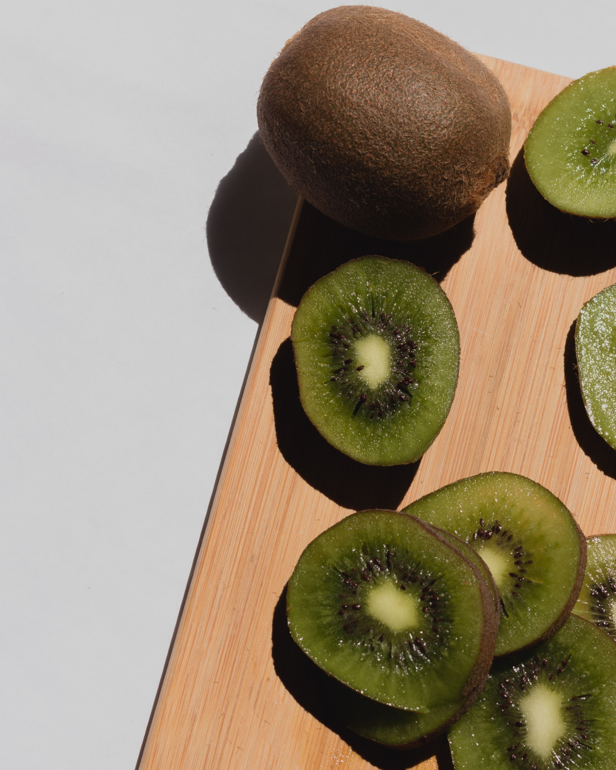 kiwi fruit on cutting board