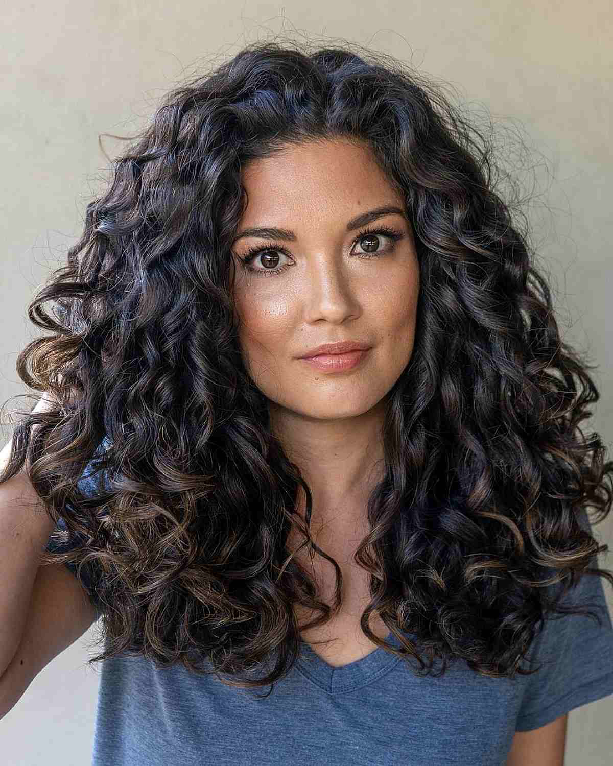 mid length thick and full jet black curls