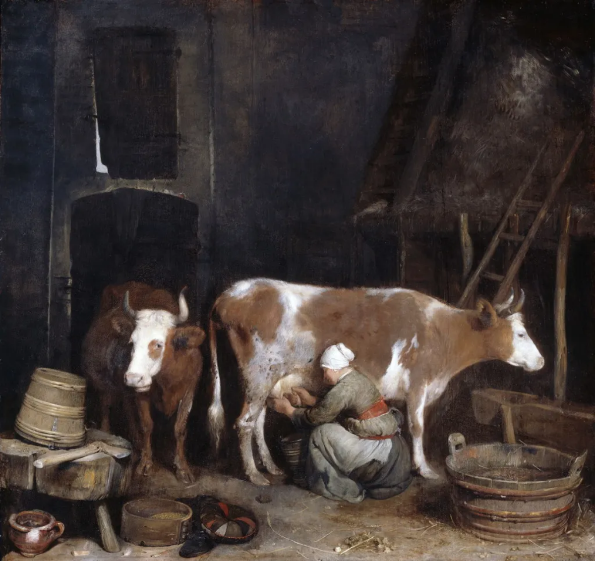 milking maid in a barn