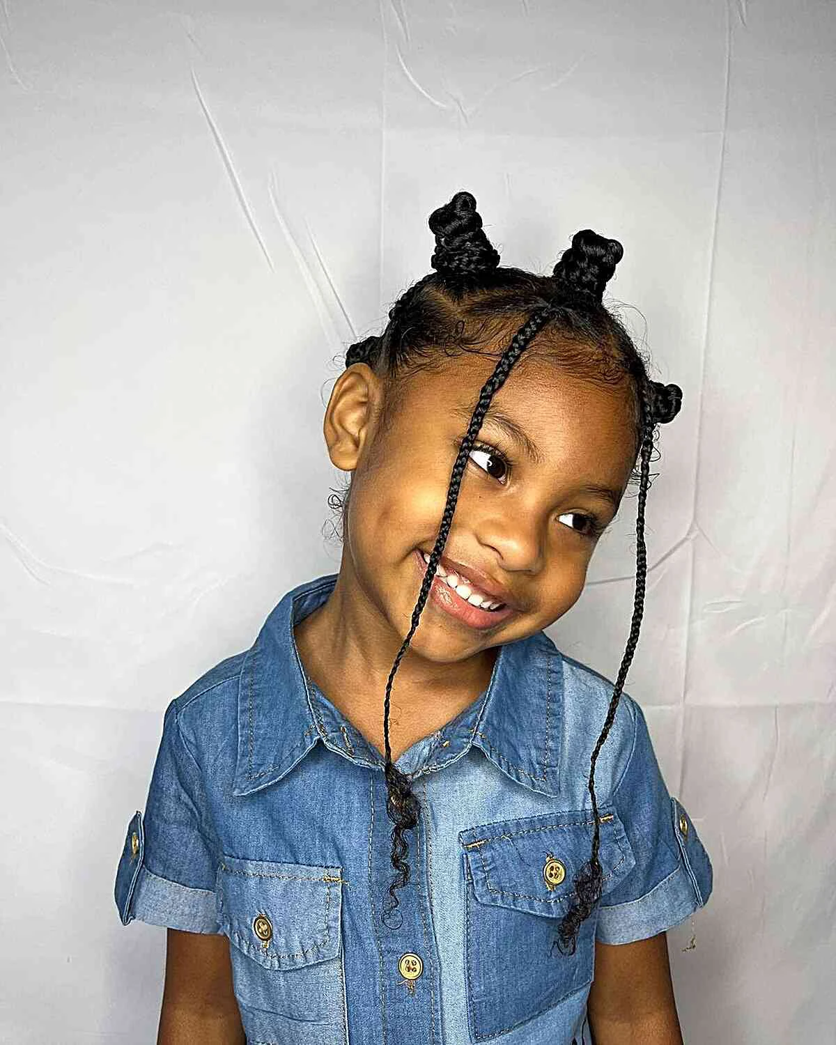 mini bantu knots with face framing box braids for young black girls