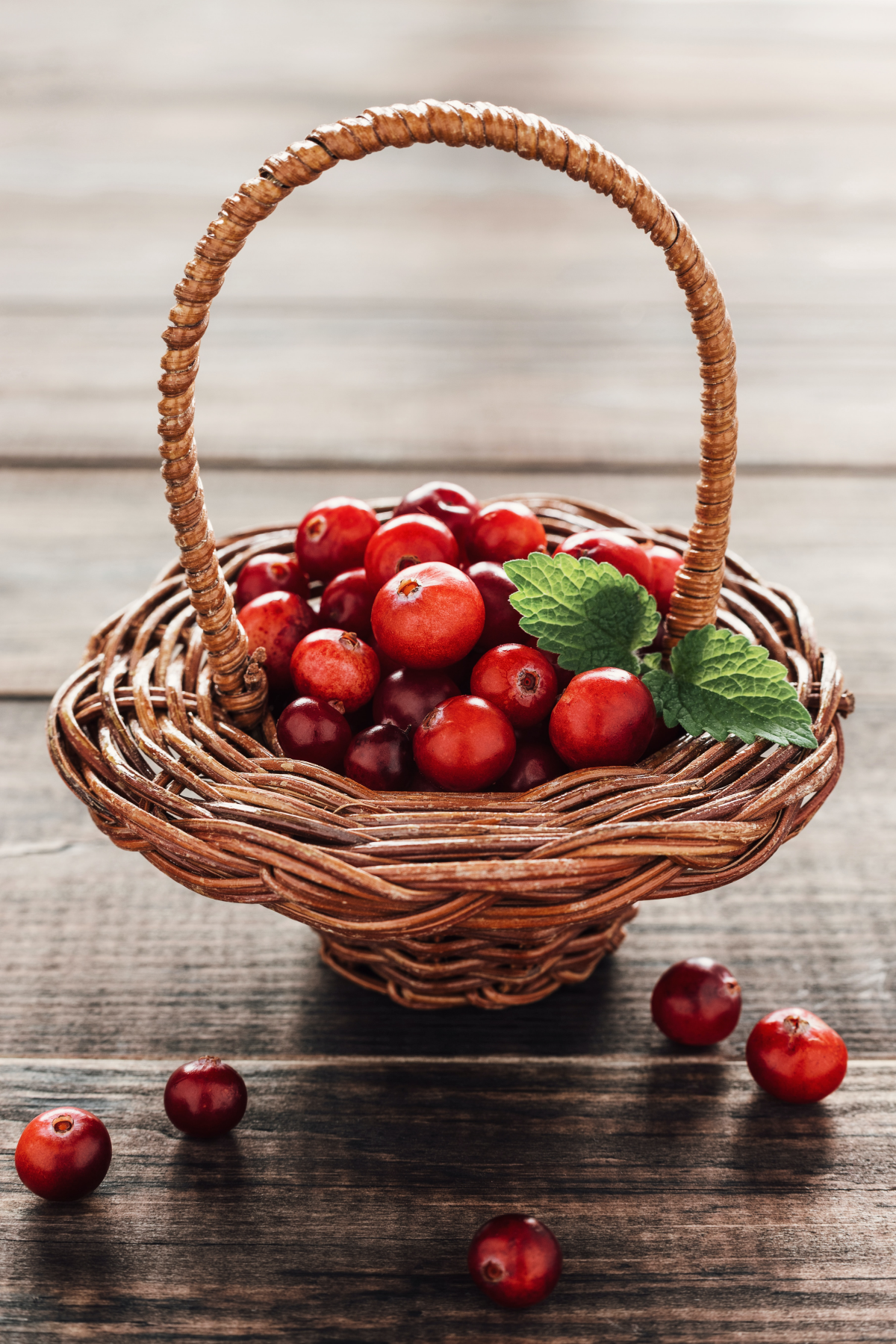red cranberries in a woven basket