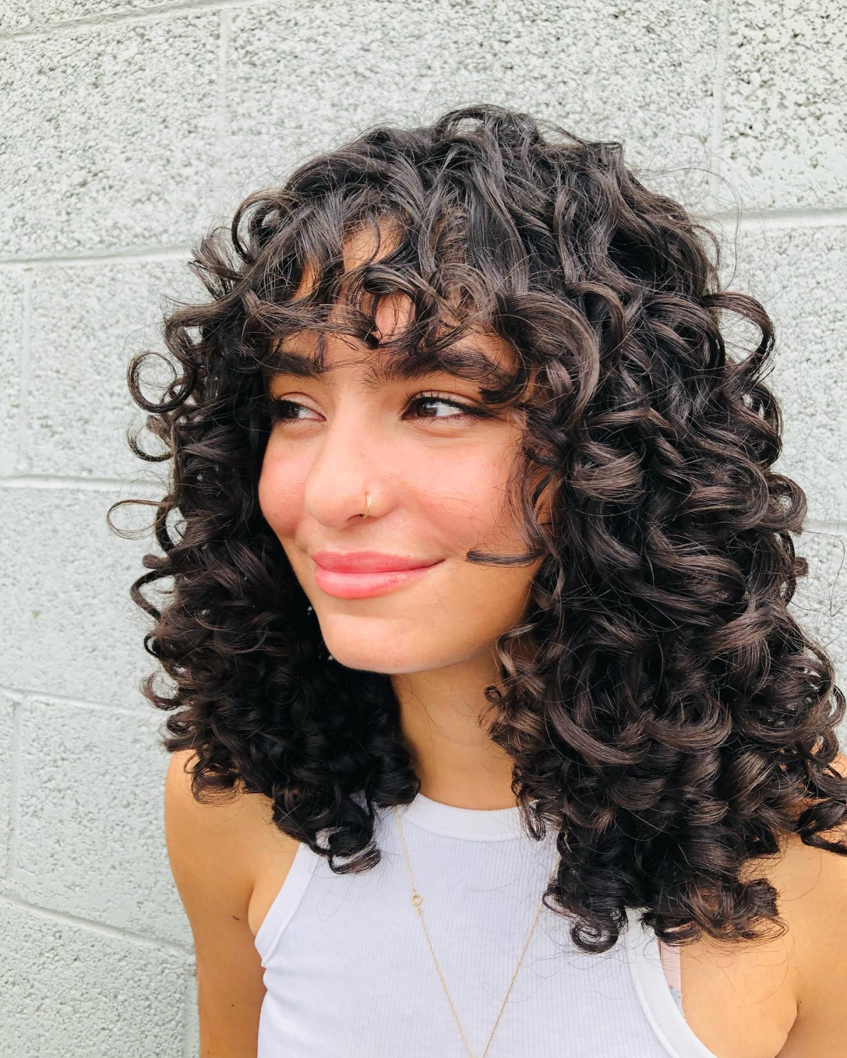 round face curtain bangs curly hair