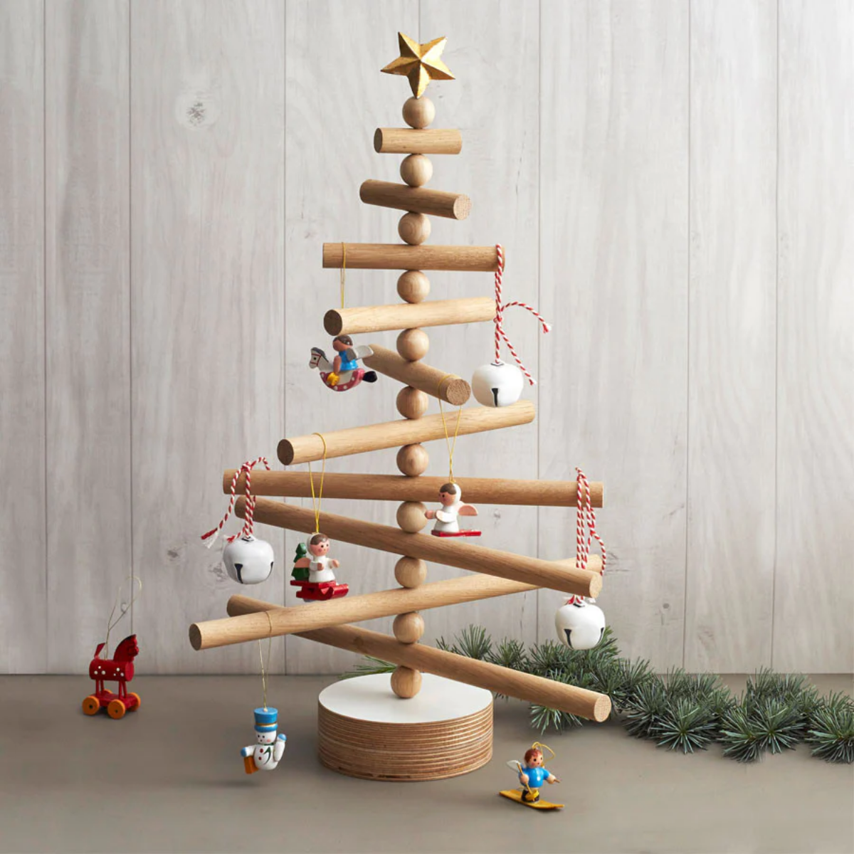 simple wooden christmas tree with ornaments