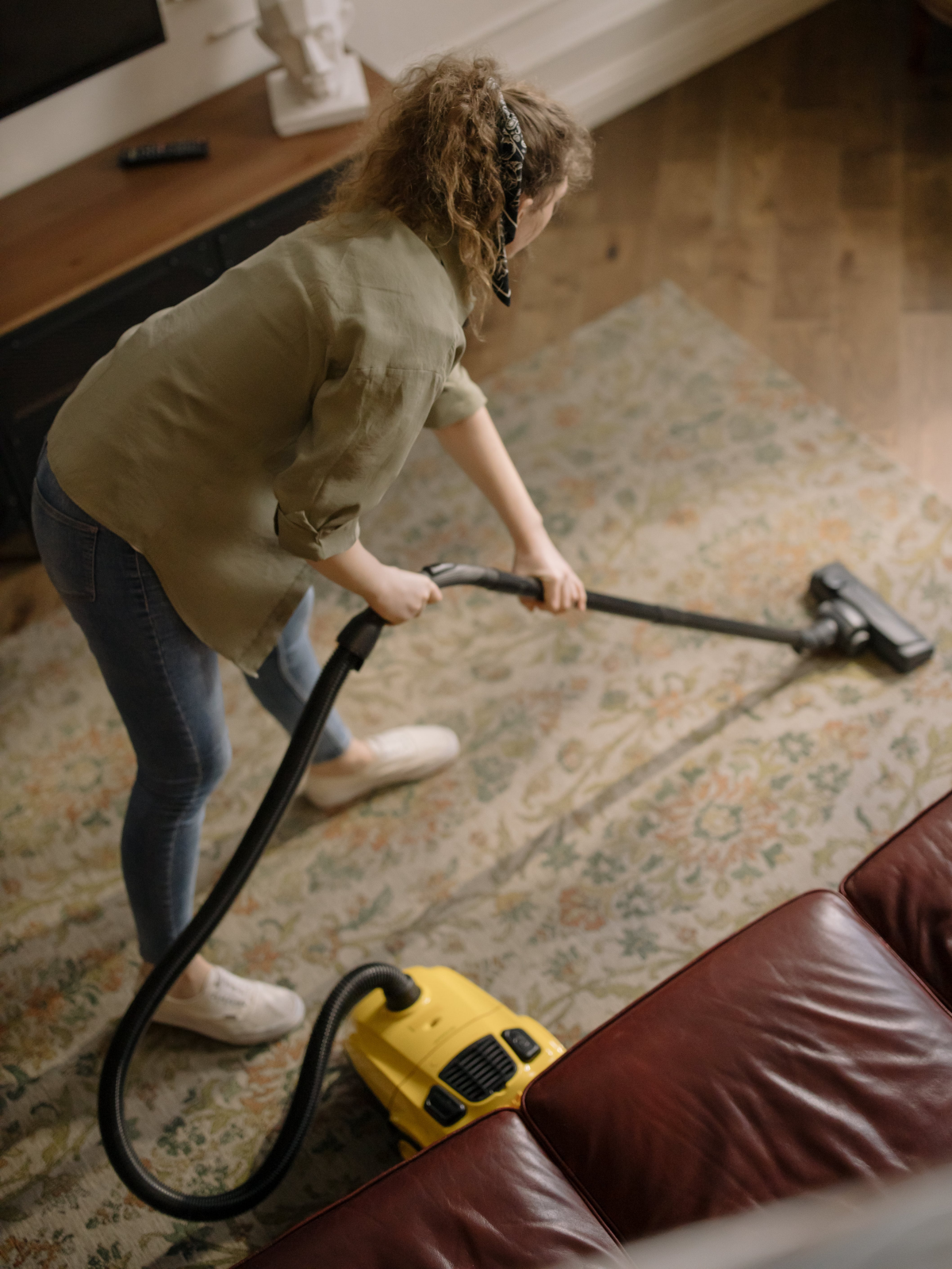 woman vacuuming carpet